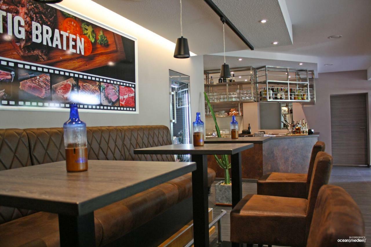 Hotel & Restaurant Am Bodden พุทบัส ภายนอก รูปภาพ